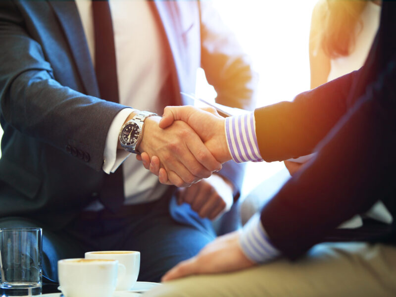 Business people shaking hands, finishing up a meeting